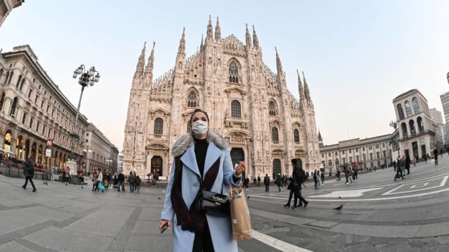 x87187104_A-woman-with-a-protective-facemask-walks-across-the-Piazza-del-Duomo-in-front-of-the-Duomo.jpg.pagespeed.ic.pe1GoCMsd1