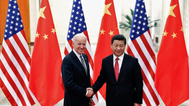 FILE PHOTO: Chinese President Xi Jinping shakes hands with U.S. Vice President Joe Biden inside the Great Hall of the People in Beijing