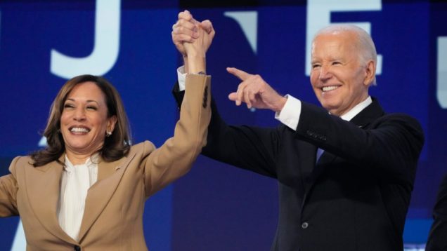 President Joe Biden speaks and Vice President Kamala Harris during the first day of the Democratic National Convention at the